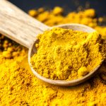 closeup-tumeric-powder-spice-spoon